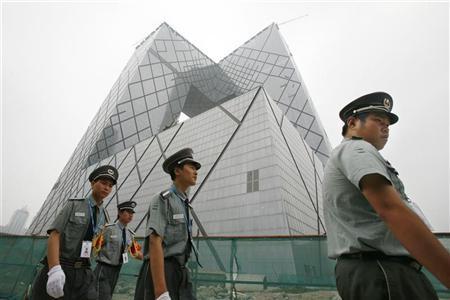 Though Koolhaas and Scheeren designed the CCTV building as a &ldquo;democratic loop&rdquo; of interconnected programs and people, the&nbsp;complex is now guarded around the clock by the People&rsquo;s Armed Police. (Photo: Reuters)