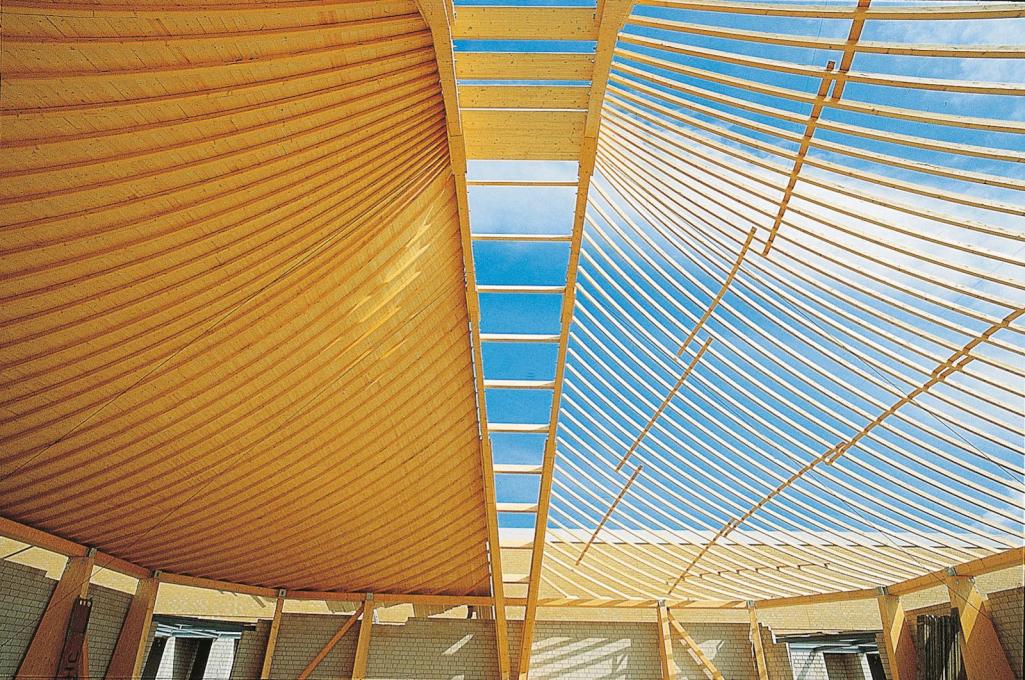Construction shot, showing the timber roof structure designed by Frei Otto.