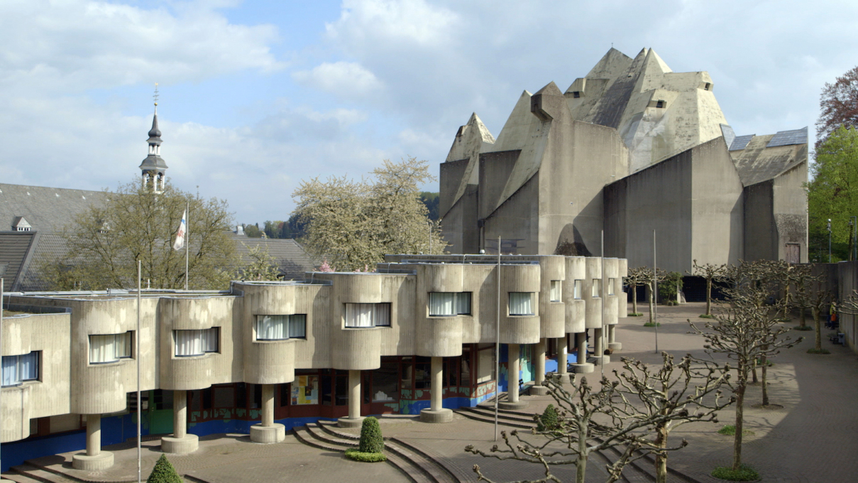 Gottfried himself is best known for his sculpturally expressive concrete structures, such as the Pilgrimage Chuch in Neviges, Germany.
