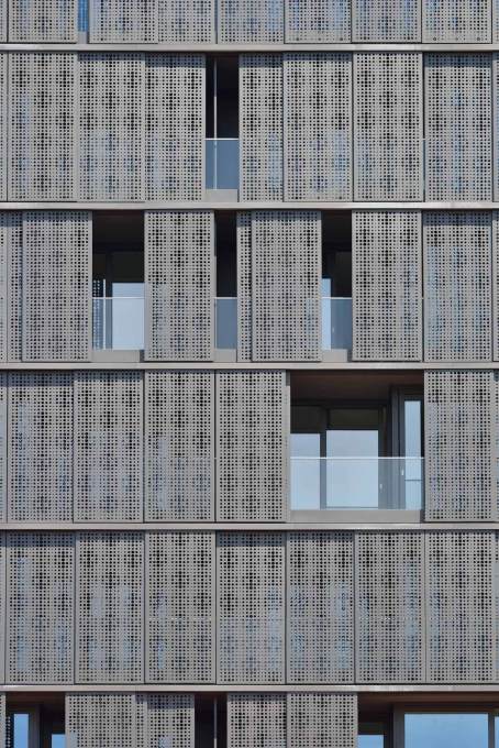 The sliding perforated aluminium panels cladding the building, allow each resident to modulate their own level of privacy...