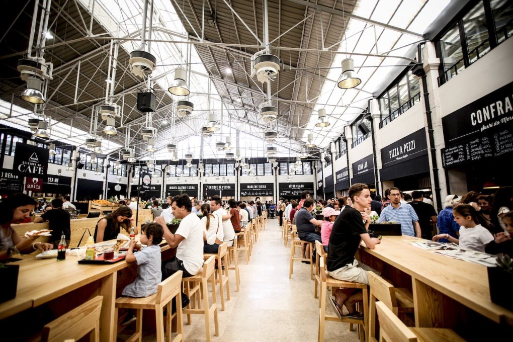 The communal eating and seating area at the newly renovated Mercado da Ribeira in Lisbon is surrounded by food outlets and shops units, above which a floor of office space is due to open. (Photo courtesy Time Out Group)