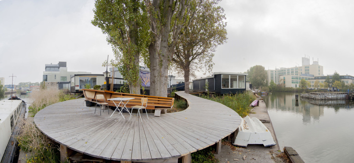 The looping boardwalk is dotted with skillfully repurposed elements. (Photo: Martin van Wijk)