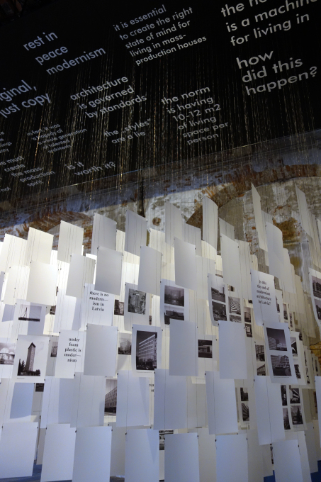 The installation is basically made from the 489 pages of the catalogue, mixing images of post-war modernist buildings in Latvia with slogans and quotes from the essays in the book. (Photo: NRJA)