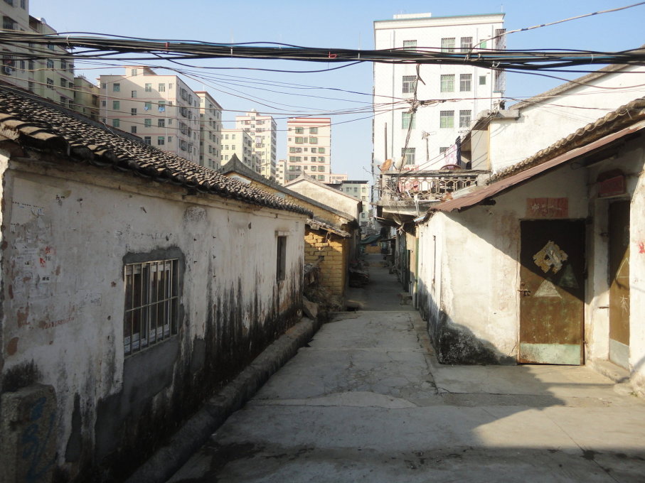 Many favor selling their homes for profit rather than preserving their architectural heritage, such as these residences in DaLang, Shenzhen. (Photo: Chris Luth)