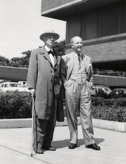 Frank Lloyd Wright and H.F. Johnson, Jr. admiring the Research Tower, 1953.