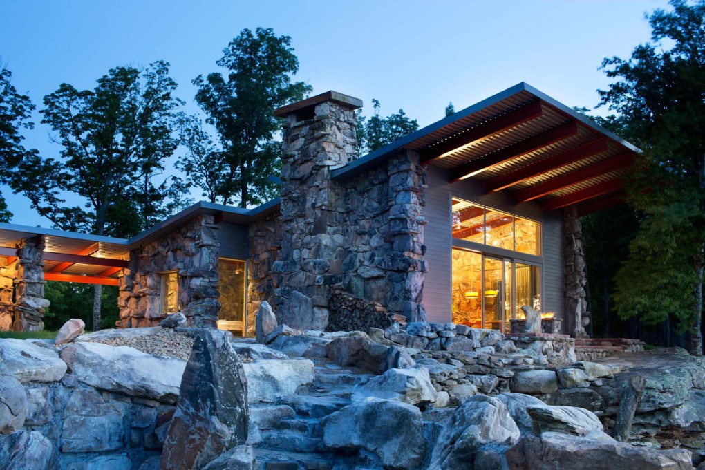 The design intent was to ground the house in the place, making it part of the bluff.