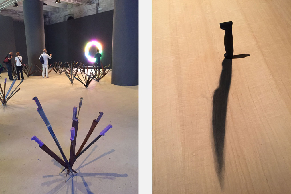 There are a lot of weapons and knives in the Arsenale: left, Adel Abdessemed sculptures &ldquo;Nymph&eacute;as&rdquo;, with Bruce Nauman neons behind, and right, a knife implanted with a painted shadow in a desk. Right: Eduardo Basualdo: &ldquo;Amenaza