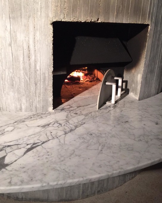...and lower down a built-in pizza oven on the outer side of the concrete spiral core. (Photo: Christian Wassmann)