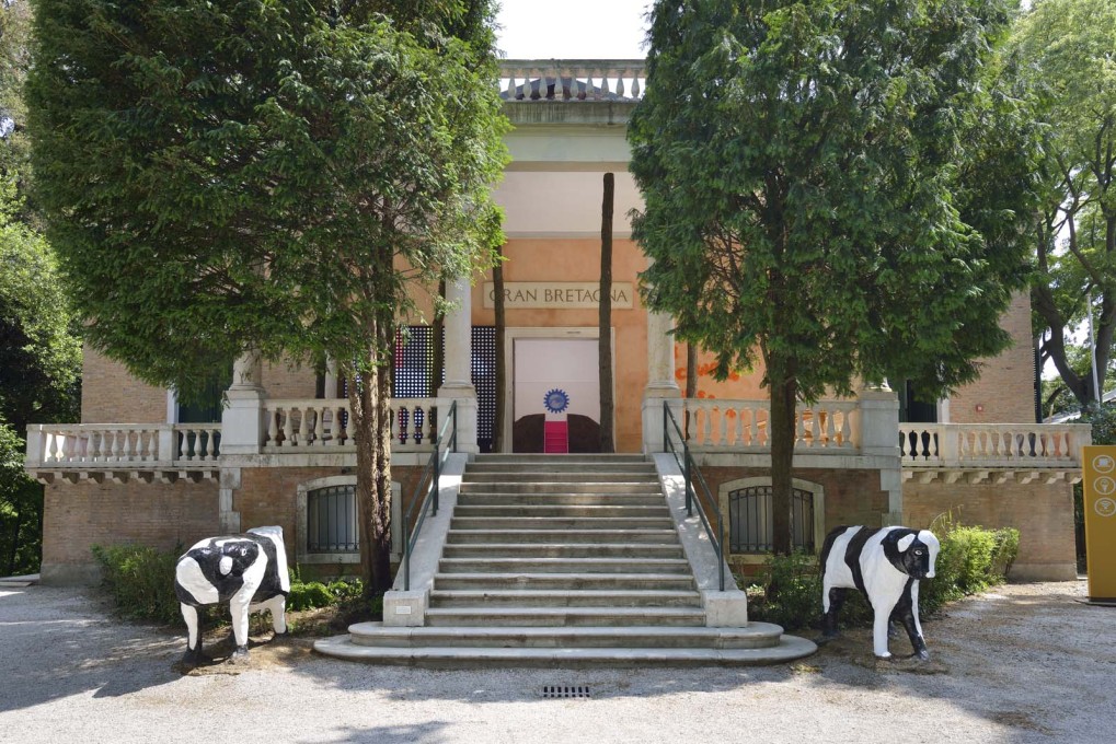 The entrance to the British Pavilion is guarded by two fibreglass, reinforced concrete cows imported from the 1970s New Town, Milton Keynes. (Photo: Cristiano Corte / British Council)
