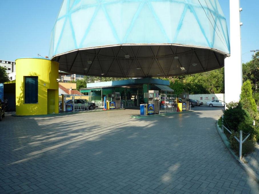 The Europetrol station designed in 2005-2006 is situated along the biggest approach road to Tirana from the airport, its huge floating dome supported at three points, one the service station with a caf&eacute;, one a car wash.