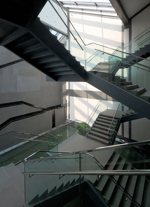 &ldquo;A structurally elaborate staircase connects the three levels of galleries. Cantilevered over serene water features and inundated with natural light from skylights, its scale is neither overwhelmingly monumental nor submissively small.&rdquo;