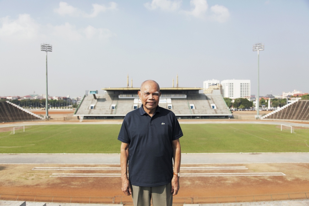 The architect Vann Molyvann standing on the tribune of the National Sports Complex in 2009. (Photo: Luke Duggleby)
