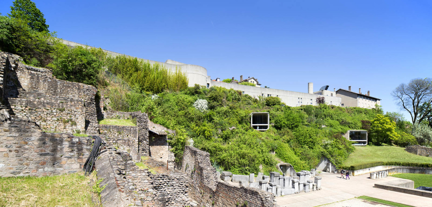The museum sits embedded into the hillside alongside the ruins of a Roman amphitheatre.