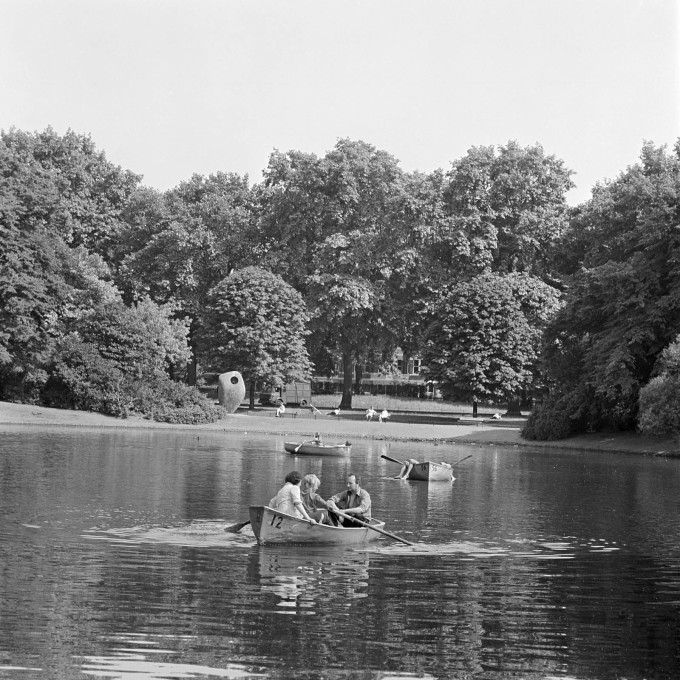 &ldquo;Single Form&rdquo; by Barbara Hepworth forms a backdrop for rowing on the boating lake at Battersea Park, London, 1962 - 1964. (&copy; Historic England)