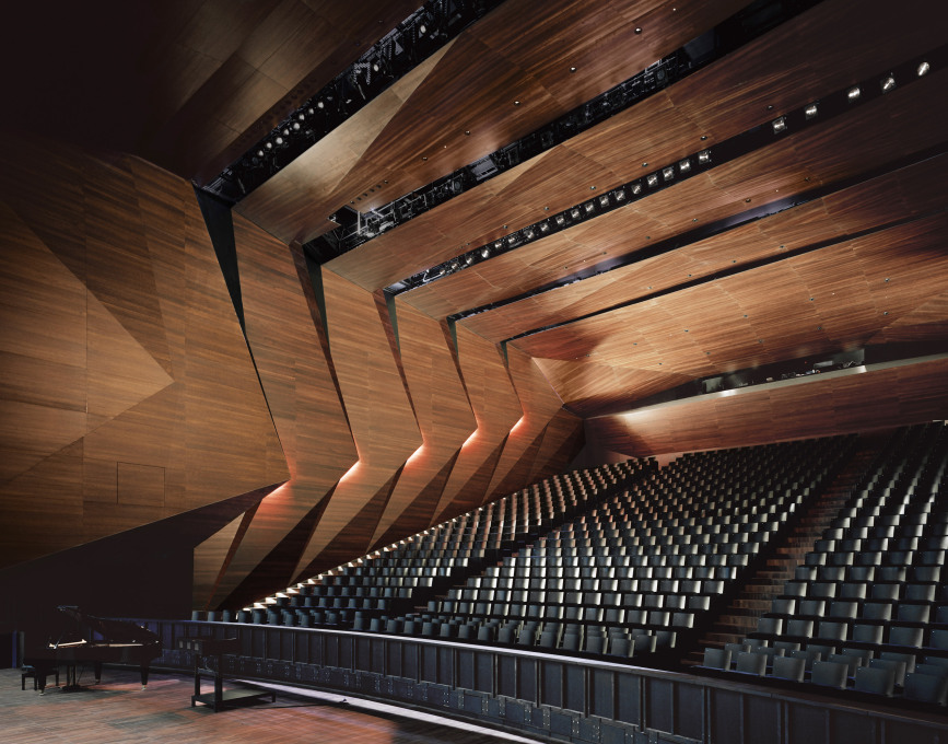 ...while the floors, walls, and ceiling of the concert hall itself are covered with stained acacia wood.