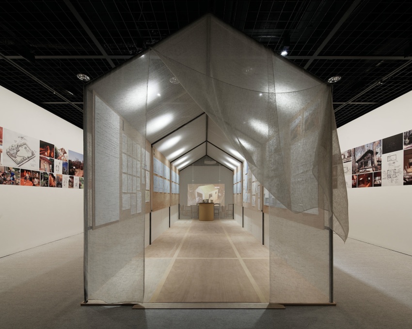 In the upstairs gallery, a structure&nbsp;sheathed in mosquito netting displays the design and construction drawings of Yoshifumi Nakamura's&nbsp;Hanem Hut, the one full-sized example in the exhibition.&nbsp;(Photo: Nac&aacute;sa &amp; Partners Inc.)&a