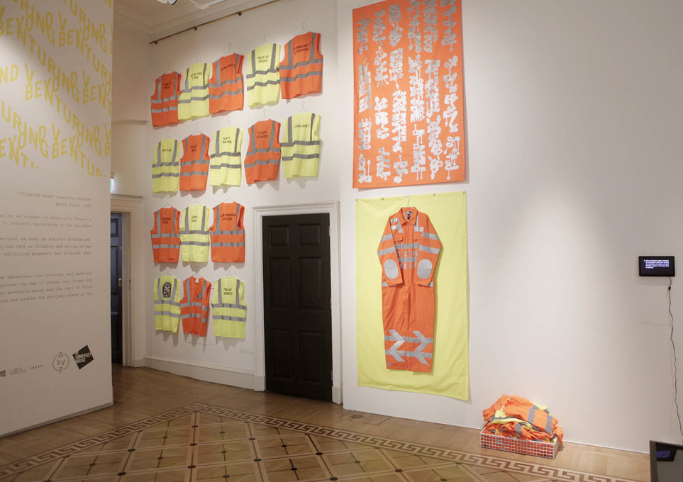 &ldquo;Utopia Security Co.&rdquo; by Petro on display at &ldquo;Venturing Beyond&rdquo;.&nbsp;The piece consists of 45 high-visibility vests, which visitors to the exhibition can wear...&nbsp;