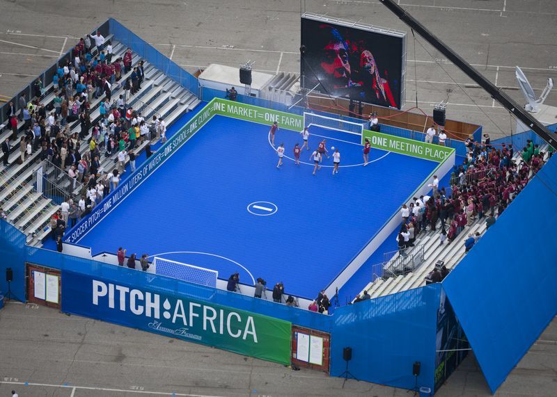 PITCHAfrica&rsquo;s rainwater harvesting street soccer pitch. Rain falls on the pitch and seating, passing through the playing-surface, which acts as a filtration layer, to be stored in a matrix of shipping containers below. (Photo: PITCHAfrica)