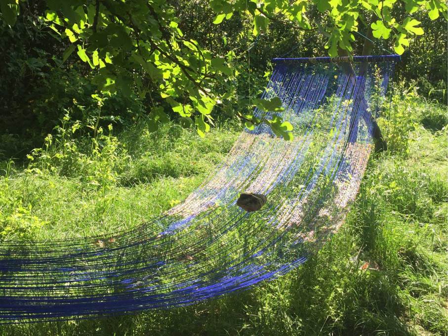 The ethereal hammocks of Sarah Sze in the Arsenale gardens.