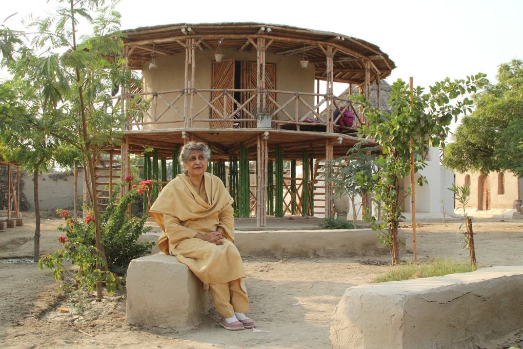 Yasmeen Lari outside a women&rsquo;s centre built with traditional materials and techniques and on stilts to survive floods in the Sindh region. (All images &copy; Al Jazeera)