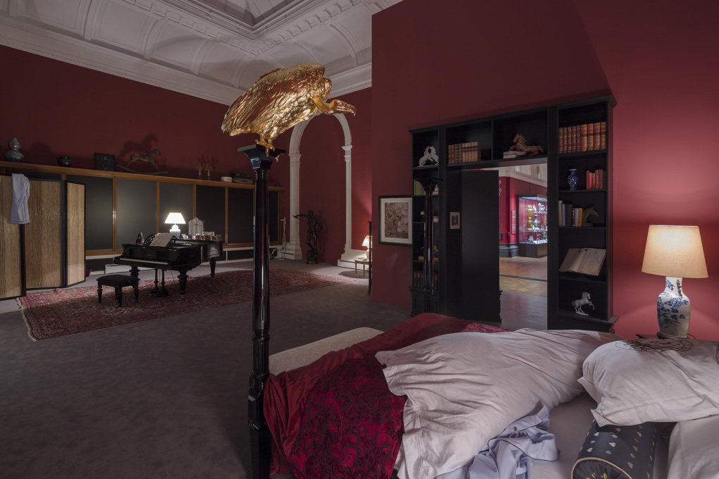 A hungry golden eagle menacingly waits to feed over the architect&rsquo;s bed. &copy; Elmgreen &amp; Dragset, photo: Anders Sune Berg, courtesy the artists and Victoria Miro